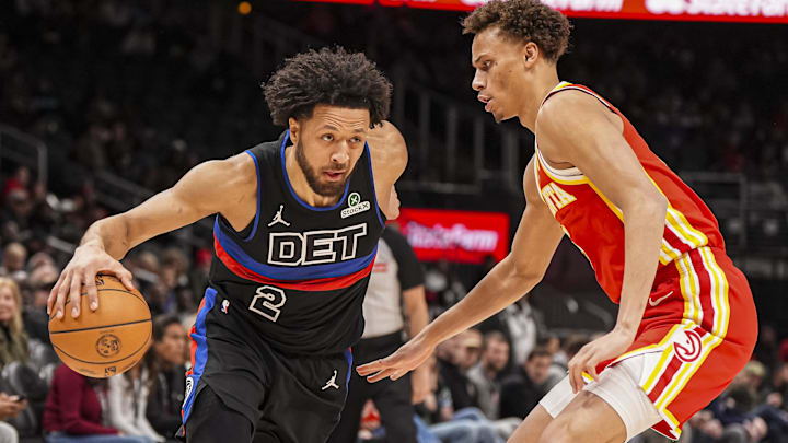 Jan 22, 2025; Atlanta, Georgia, USA; Detroit Pistons guard Cade Cunningham (2) dribbles against Atlanta Hawks guard Dyson Daniels (5) during the first half at State Farm Arena. Mandatory Credit: Dale Zanine-Imagn Images
