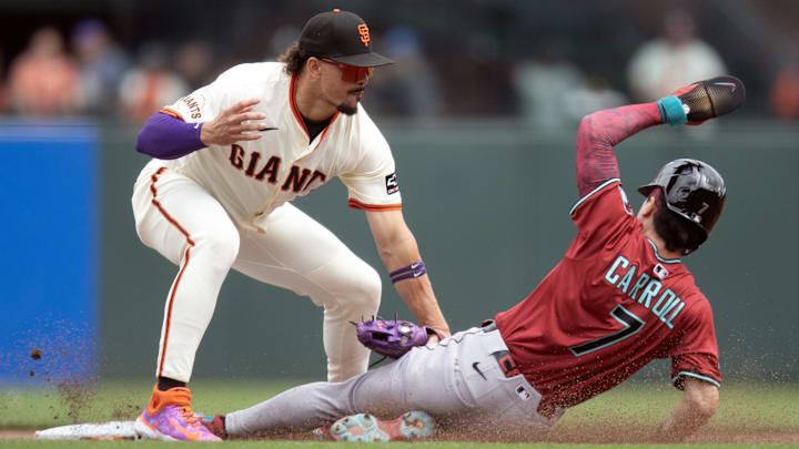 Sep 10, 2025; San Francisco, California, USA; San Francisco Giants shortstop Willy Adames (2) applies the tag to Arizona Diamondbacks right fielder Corbin Carroll (7) as he attempts to steal second base during the fifth inning at Oracle Park. Mandatory Credit: D. Ross Cameron-Imagn Images