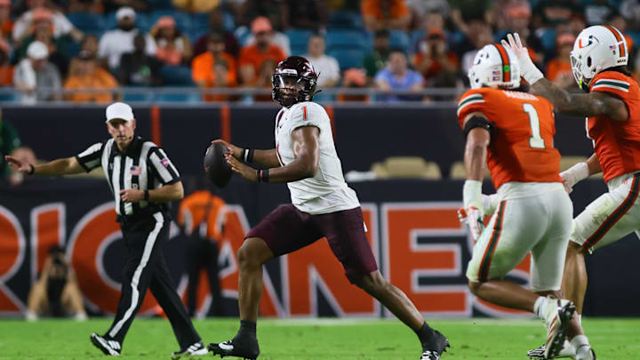 Sep 27, 2024; Miami Gardens, Florida, USA; Virginia Tech Hokies quarterback Kyron Drones (1) runs with the football against the Miami Hurricanes during the second quarter at Hard Rock Stadium. Mandatory Credit: Sam Navarro-Imagn Images Sep 27, 2024; Miami Gardens, Florida, USA; Virginia Tech Hokies quarterback Kyron Drones (1) runs with the football against the Miami Hurricanes during the second quarter at Hard Rock Stadium. Mandatory Credit: Sam Navarro-Imagn Images