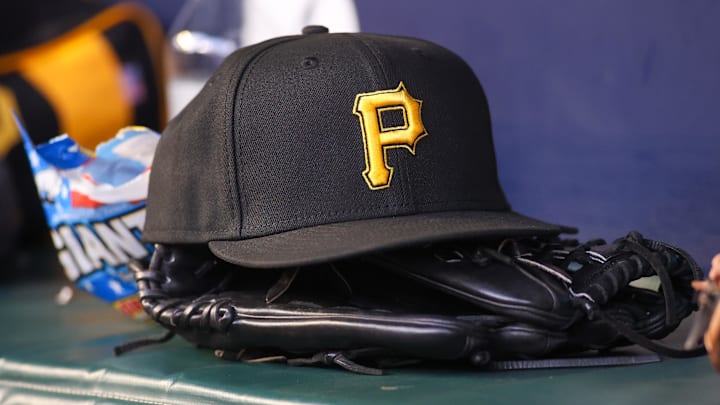 Sep 8, 2023; Atlanta, Georgia, USA; A detailed view of a Pittsburgh Pirates hat and glove before a game against the Pittsburgh Pirates in the first inning at Truist Park. Mandatory Credit: Brett Davis-Imagn Images