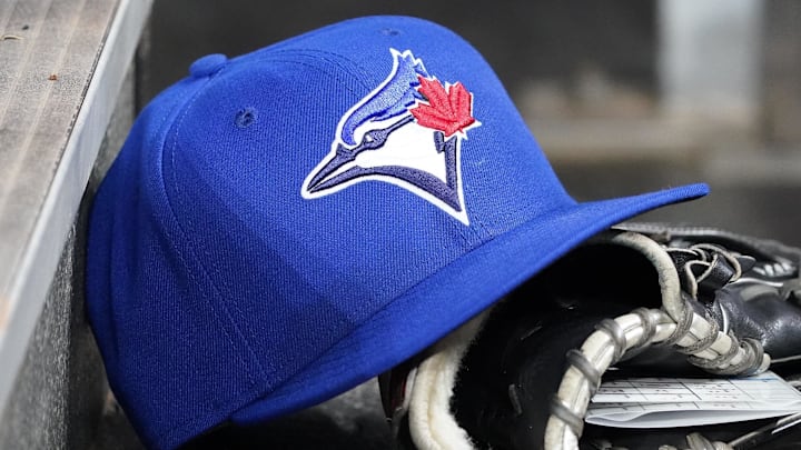 Apr 16, 2025; Toronto, Ontario, CAN; A Toronto Blue Jays hat and glove in the dugout during a game against the Atlanta Braves at Rogers Centre. Apr 16, 2025; Toronto, Ontario, CAN; A Toronto Blue Jays hat and glove in the dugout during a game against the Atlanta Braves at Rogers Centre.