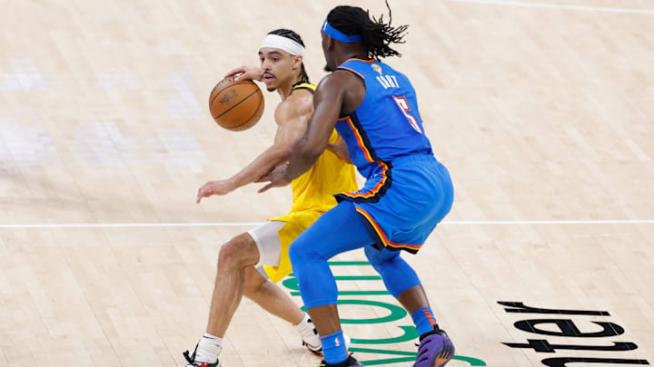 Jun 22, 2025; Oklahoma City, Oklahoma, USA; Indiana Pacers guard Andrew Nembhard (2) dribbles the ball against Oklahoma City Thunder guard Luguentz Dort (5) during the second half of game seven of the 2025 NBA Finals at Paycom Center. Mandatory Credit: Alonzo Adams-Imagn Images