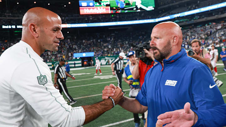 Aug 24, 2024; East Rutherford, New Jersey, USA; New York Jets head coach Robert Saleh, left, shakes hands with New York Giants head coach Brian Daboll after the game at MetLife Stadium. Mandatory Credit: Vincent Carchietta-USA TODAY Sports
