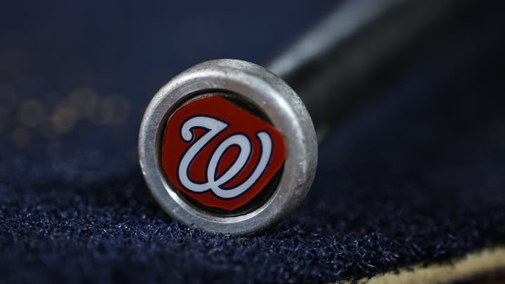 May 12, 2023; Washington, District of Columbia, USA; A detailed view of the Washington Nationals logo on a weighted bat during the seventh inning of the game between the Washington Nationals and the New York Mets at Nationals Park. 