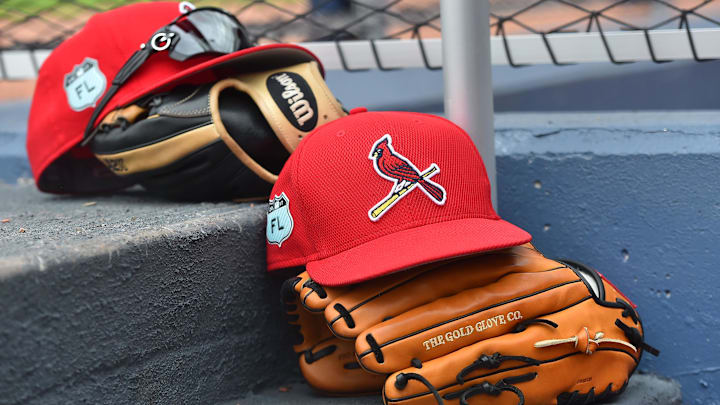 Mar 3, 2017; West Palm Beach, FL, USA; A view of St. Louis Cardinals hats and gloves on the steps of the dugout in the game against the Washington Nationals at The Ballpark of the Palm Beaches. Mandatory Credit: Jasen Vinlove-Imagn Images