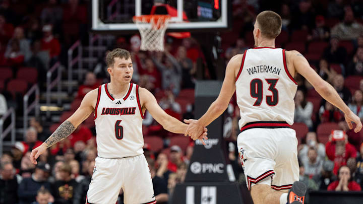 Louisville Cardinals guard Reyne Smith (6) celebrates Noah Waterman’s (93) three pointer during their game against the UTEP Miners on Wednesday, Dec. 11, 2024 at the KFC Yum! Center in Louisville, Ky. Louisville Cardinals guard Reyne Smith (6) celebrates Noah Waterman’s (93) three pointer during their game against the UTEP Miners on Wednesday, Dec. 11, 2024 at the KFC Yum! Center in Louisville, Ky.