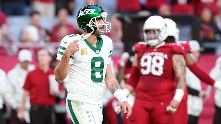 Nov 10, 2024; Glendale, Arizona, USA; New York Jets quarterback Aaron Rodgers (8) walks off the field against the Arizona Cardinals during the second half at State Farm Stadium. 