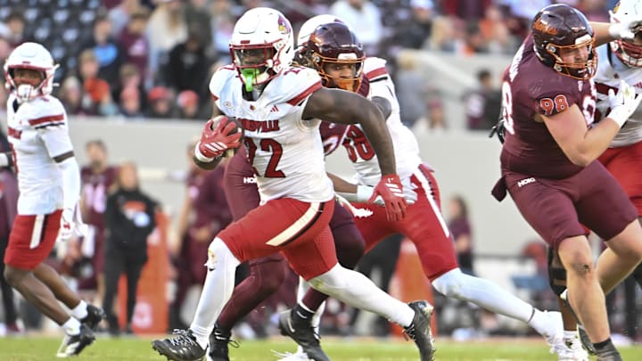 Nov 1, 2025; Blacksburg, Virginia, USA; Louisville Cardinals running back Keyjuan Brown (22) runs the ball for a touchdown against the Virginia Tech Hokies during the fourth quarter at Lane Stadium. Mandatory Credit: Brian Bishop-Imagn Images