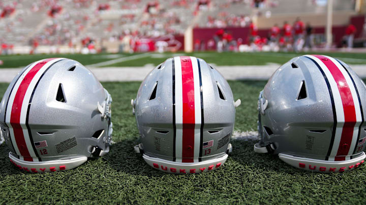 Sep 2, 2023; Bloomington, Indiana, USA; Ohio State Buckeyes helmets sit on the sideline prior to the NCAA football game at Indiana University Memorial Stadium.