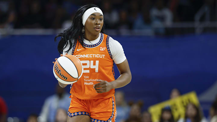 Aug 23, 2025; Chicago, Illinois, USA; Connecticut Sun forward Aneesah Morrow (24) brings the ball up court against the Chicago Sky during the first half at Wintrust Arena.