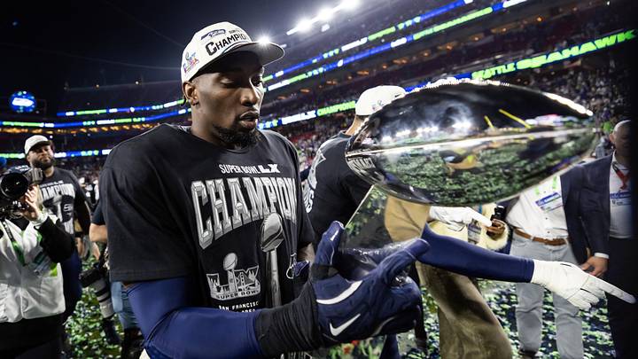 Feb 8, 2026; Santa Clara, CA, USA; Seattle Seahawks defensive end DeMarcus Lawrence (0) celebrates with the Vince Lombardi Trophy after defeating the New England Patriots during Super Bowl LX at Levi's Stadium. Mandatory Credit: Mark J. Rebilas-Imagn Images Feb 8, 2026; Santa Clara, CA, USA; Seattle Seahawks defensive end DeMarcus Lawrence (0) celebrates with the Vince Lombardi Trophy after defeating the New England Patriots during Super Bowl LX at Levi's Stadium. Mandatory Credit: Mark J. Rebilas-Imagn Images