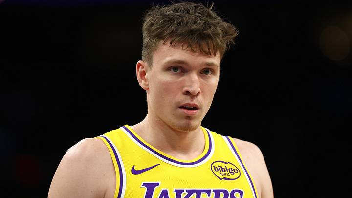 Dec 23, 2025; Phoenix, Arizona, USA; Los Angeles Lakers forward Dalton Knecht (4) against the Phoenix Suns at Mortgage Matchup Center. Mandatory Credit: Mark J. Rebilas-Imagn Images