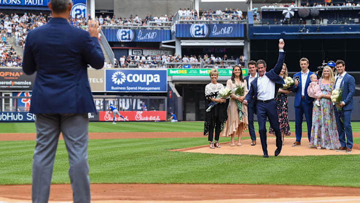 Aug 21, 2022; Bronx, New York, USA; New York Yankees former player Paul O'Neil throws out the first pitch to Jorge Posada before the game between the New York Yankees and Toronto Blue Jays at Yankee Stadium.
