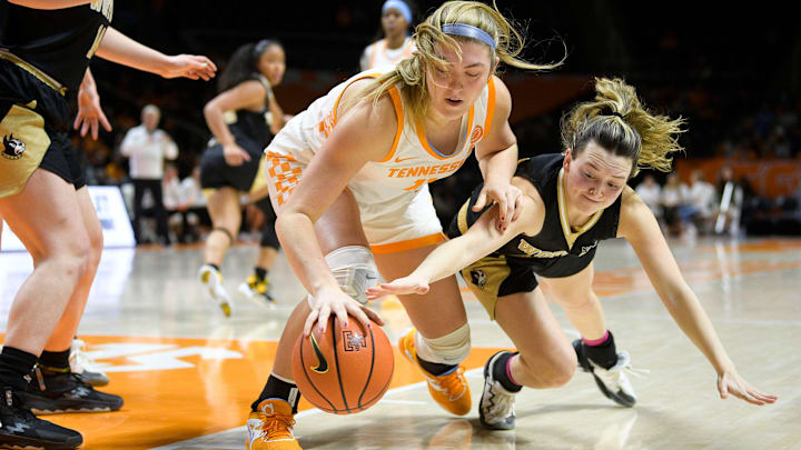 Tennessee forward Karoline Striplin (11) and Wofford guard Rachael Rose (12) battle for the ball during a game between Tennessee and Wofford at Thompson-Boling Arena in Knoxville, Tenn., on Tuesday, Dec. 27, 2022.