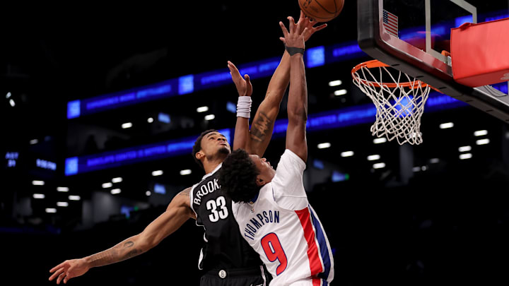 Dec 23, 2023; Brooklyn, New York, USA; Brooklyn Nets center Nic Claxton (33) blocks a shot by Detroit Pistons forward Ausar Thompson (9) during the fourth quarter at Barclays Center. Mandatory Credit: Brad Penner-Imagn Images