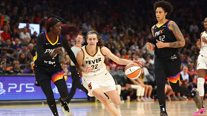 Jun 30, 2024; Phoenix, Arizona, USA; Indiana Fever guard Caitlin Clark (22) against Phoenix Mercury guard Kahleah Copper (2) and center Brittney Griner (42) during a WNBA game at Footprint Center. Mandatory Credit: Mark J. Rebilas-Imagn Images Jun 30, 2024; Phoenix, Arizona, USA; Indiana Fever guard Caitlin Clark (22) against Phoenix Mercury guard Kahleah Copper (2) and center Brittney Griner (42) during a WNBA game at Footprint Center. Mandatory Credit: Mark J. Rebilas-Imagn Images