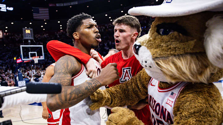 Arizona's Caleb Love (left) celebrates after making a shot from beyond half court to force overtime in an eventual win against Iowa State on Jan. 27, 2025. Arizona's Caleb Love (left) celebrates after making a shot from beyond half court to force overtime in an eventual win against Iowa State on Jan. 27, 2025.