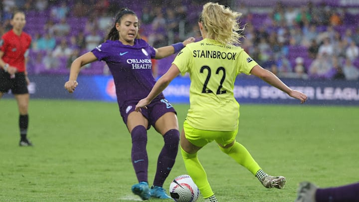 Oct 6, 2024; Orlando, Florida, USA; Orlando Pride midfielder Angelina (15) and Washington Spirit midfielder Heather Stainbrook (22) battle for the ball in the second half at Inter&Co Stadium. Mandatory Credit: Mike Watters-Imagn Images