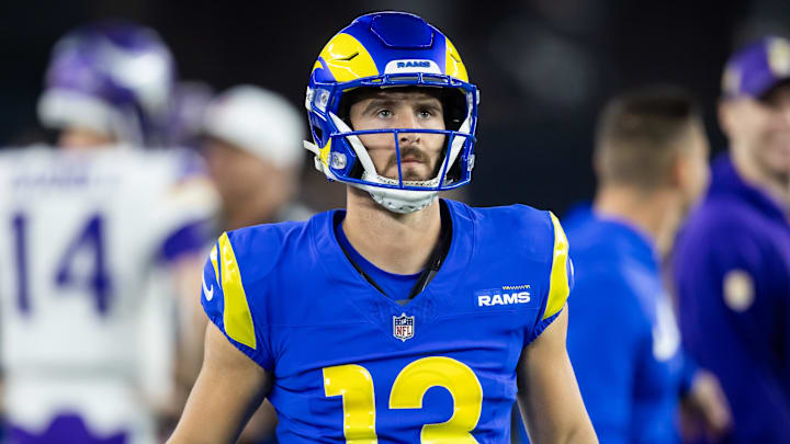 Jan 13, 2025; Glendale, AZ, USA; Los Angeles Rams quarterback Stetson Bennett (13) against the Minnesota Vikings during an NFC wild card game at State Farm Stadium. Mandatory Credit: Mark J. Rebilas-Imagn Images