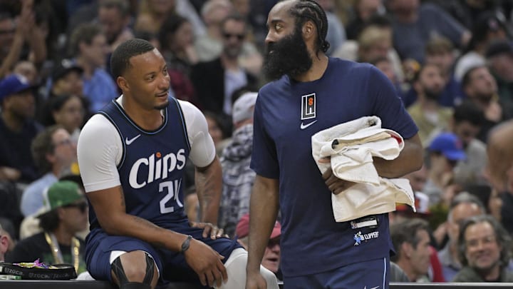 Mar 1, 2024; Los Angeles, California, USA;  Los Angeles Clippers guard Norman Powell (24) talks with guard James Harden (1) on the bench in the second half against the Washington Wizards at Crypto.com Arena. Mandatory Credit: Jayne Kamin-Oncea-Imagn Images