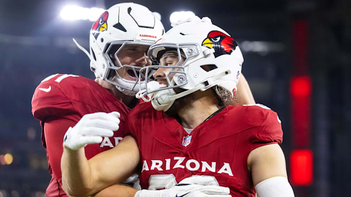 Aug 23, 2025; Glendale, Arizona, USA; Arizona Cardinals wide receiver Simi Fehoko (80) celebrates a touchdown with teammate Travis Vokolek (81) against the Las Vegas Raiders during a preseason NFL game at State Farm Stadium. Mandatory Credit: Mark J. Rebilas-Imagn Images
Aug 23, 2025; Glendale, Arizona, USA; Arizona Cardinals wide receiver Simi Fehoko (80) celebrates a touchdown with teammate Travis Vokolek (81) against the Las Vegas Raiders during a preseason NFL game at State Farm Stadium. Mandatory Credit: Mark J. Rebilas-Imagn Images