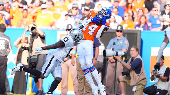 Oct 6, 2024; Denver, Colorado, USA; Denver Broncos wide receiver Courtland Sutton (14) pulls in a reception over Las Vegas Raiders cornerback Jakorian Bennett (0) in the fourth quarter at Empower Field at Mile High. Mandatory Credit: Ron Chenoy-Imagn Images Oct 6, 2024; Denver, Colorado, USA; Denver Broncos wide receiver Courtland Sutton (14) pulls in a reception over Las Vegas Raiders cornerback Jakorian Bennett (0) in the fourth quarter at Empower Field at Mile High. Mandatory Credit: Ron Chenoy-Imagn Images