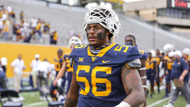 Sep 12, 2020; Morgantown, West Virginia, USA; West Virginia Mountaineers defensive lineman Darius Stills (56) celebrates after defeating the Eastern Kentucky Colonels at Mountaineer Field at Milan Puskar Stadium. Mandatory Credit: Ben Queen-Imagn Images