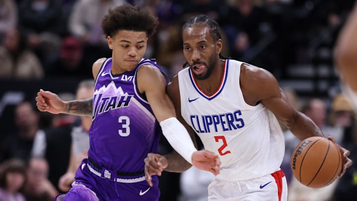 Los Angeles Clippers forward Kawhi Leonard (2) brings the ball up the court against Utah Jazz guard Keyonte George (3) during the second half at Delta Center. Mandatory Credit: Rob Gray-Imagn Images