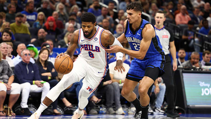 Nov 15, 2024; Orlando, Florida, USA; Philadelphia 76ers forward Paul George (8) drives to the basket past Orlando Magic forward Tristan da Silva (23)in the first quarter at Kia Center. Mandatory Credit: Nathan Ray Seebeck-Imagn Images