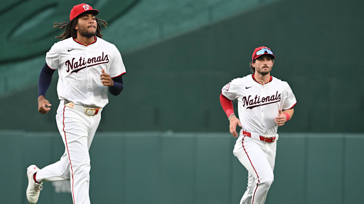 Aug 26, 2024; Washington, District of Columbia, USA; Washington Nationals left fielder James Wood (29) and center fielder Dylan Crews (3) warm up before a game against the New York Yankees at Nationals Park.