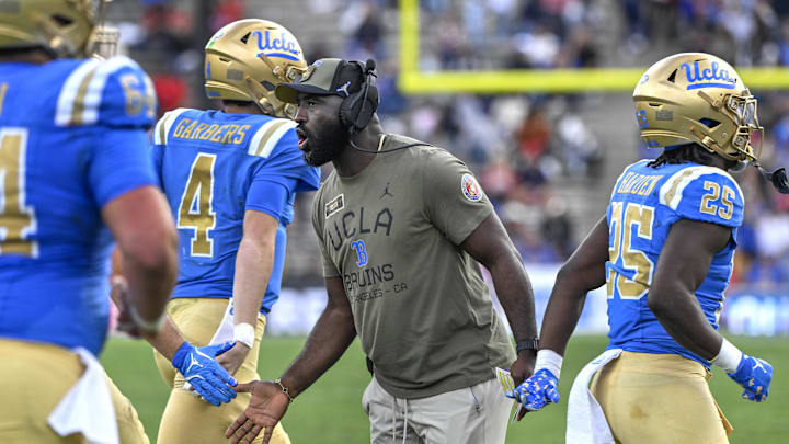 Nov 30, 2024; Pasadena, California, USA; UCLA Bruins head coach DeShaun Foster greets his players after a Bruins touchdown against the Fresno State Bulldogs in the third quarter at Rose Bowl. Mandatory Credit: Robert Hanashiro-Imagn Images