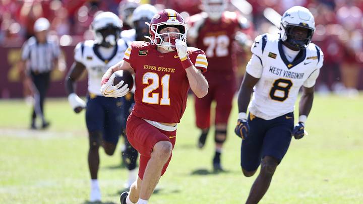 Oct 3, 2026; Ames, Iowa, USA;  Iowa State Cyclones running back Aiden Flora (21) breaks through the West Virginia Mountaineers defense for a touchdown during the second half at Jack Trice Stadium.  Mandatory Credit: Reese Strickland-Imagn Images