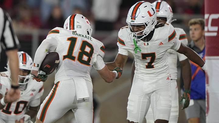 Sep 4, 2026; Stanford, California, USA; Miami Hurricanes wide receiver Cooper Barkate (18) reacts with wide receiver Daylyn Upshaw (7) after catching a touchdown pass against the Stanford Cardinal during the third quarter at Stanford Stadium. Mandatory Credit: Stan Szeto-Imagn Images Sep 4, 2026; Stanford, California, USA; Miami Hurricanes wide receiver Cooper Barkate (18) reacts with wide receiver Daylyn Upshaw (7) after catching a touchdown pass against the Stanford Cardinal during the third quarter at Stanford Stadium. Mandatory Credit: Stan Szeto-Imagn Images