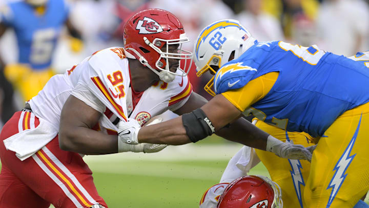 Sep 29, 2024; Inglewood, California, USA;  Kansas City Chiefs defensive tackle Chris Jones (95) and Los Angeles Chargers center Sam Mustipher (62) battle at the line in the second half at SoFi Stadium. Mandatory Credit: Jayne Kamin-Oncea-Imagn Images