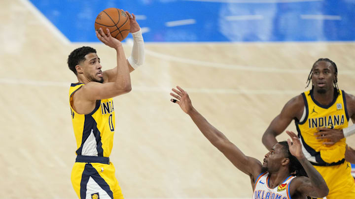 Jun 5, 2025; Oklahoma City, Oklahoma, USA; Indiana Pacers guard Tyrese Haliburton (0) shoots the ball against Oklahoma City Thunder guard Cason Wallace (22) during the fourth quarter in game one of the 2025 NBA Finals at Paycom Center. Mandatory Credit: Kyle Terada-Imagn Images