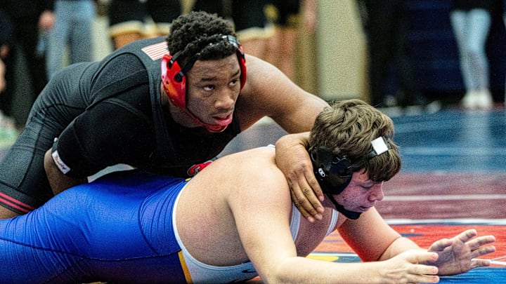 Fort Dodge's Dreshaun Ross wrestles Johnston's Mason Roethler during the 215-pound semifinal match of the Ed Winger Invite at Urbandale High School on Saturday, Jan. 20, 2024, in Urbandale.
