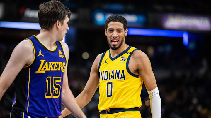Mar 29, 2024; Indianapolis, Indiana, USA; Indiana Pacers guard Tyrese Haliburton (0) reacts to a made basket in the second half against the Los Angeles Lakers at Gainbridge Fieldhouse. Mandatory Credit: Trevor Ruszkowski-Imagn Images