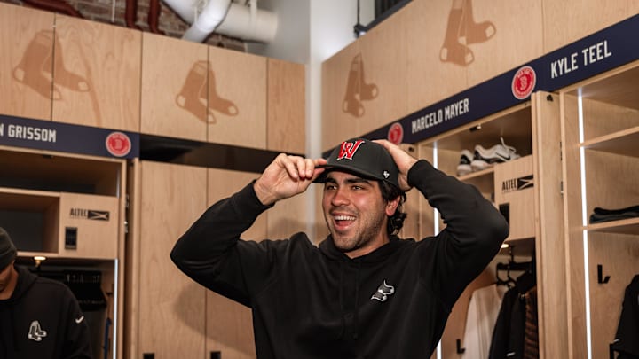 Boston Red Sox prospect Marcelo Mayer is all smiles when trying on a WooSox hat during the Red Sox Development Program inside the Sox clubhouse at Fenway Park on Wednesday. Boston Red Sox prospect Marcelo Mayer is all smiles when trying on a WooSox hat during the Red Sox Development Program inside the Sox clubhouse at Fenway Park on Wednesday.