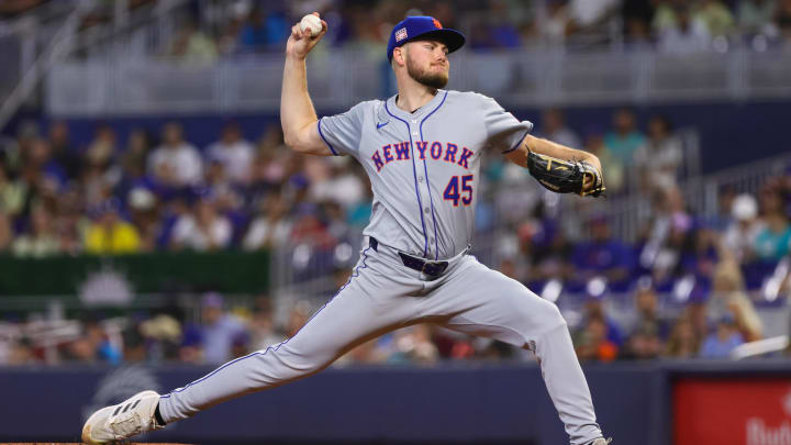 Jul 21, 2024; Miami, Florida, USA; New York Mets starting pitcher Christian Scott (45) delivers a pitch against the Miami Marlins during the first inning at loanDepot Park. Mandatory Credit: Sam Navarro-USA TODAY Sports