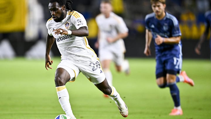 Sep 27, 2025; Carson, California, USA; LA Galaxy forward Joseph Paintsil (28) pushes the ball down the field against Sporting Kansas City during the second half at Dignity Health Sports Park. Mandatory Credit: Kelvin Kuo-Imagn Images
