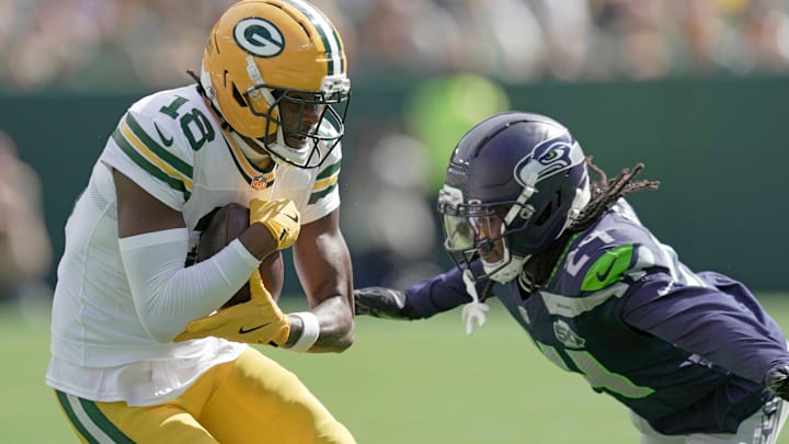 Green Bay Packers wide receiver Malik Heath (18) makes a catch before being tackles by Seattle Seahawks cornerback Shaquill Griffin (24) during the first quarter of their preseason game Saturday, August 23, 2025 at Lambeau Field in Green Bay, Wisconsin. Green Bay Packers wide receiver Malik Heath (18) makes a catch before being tackles by Seattle Seahawks cornerback Shaquill Griffin (24) during the first quarter of their preseason game Saturday, August 23, 2025 at Lambeau Field in Green Bay, Wisconsin.