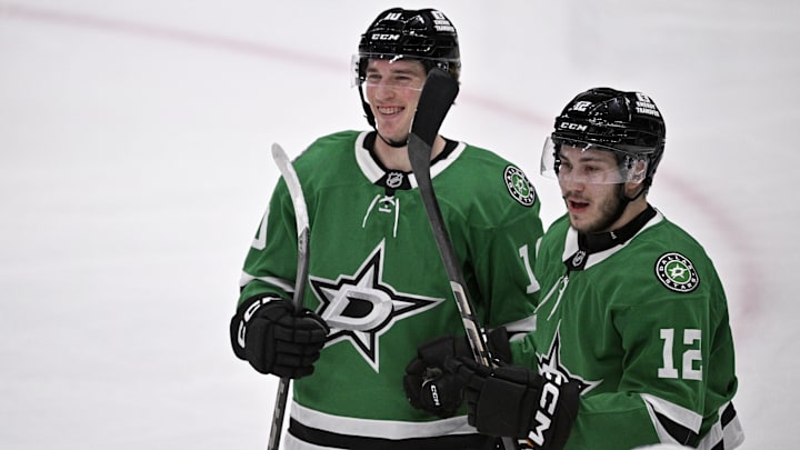 Jan 4, 2025; Dallas, Texas, USA; Dallas Stars center Oskar Back (10) and right wing Arttu Hyry (12) celebrates a goal scored by Back against the Utah Hockey Club during the second period at the American Airlines Center. Mandatory Credit: Jerome Miron-Imagn Images