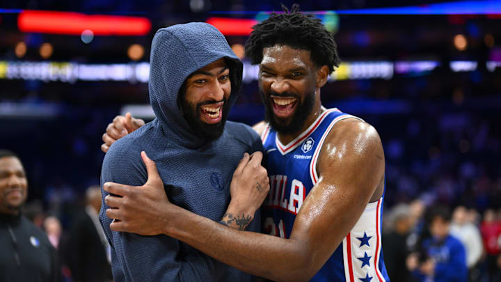 Feb 4, 2025; Philadelphia, Pennsylvania, USA; Dallas Mavericks forward Anthony Davis (3) reacts with Philadelphia 76ers center Joel Embiid (21) after the game at Wells Fargo Center. Mandatory Credit: Kyle Ross-Imagn Images