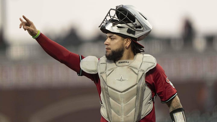 Sep 4, 2024; San Francisco, California, USA; Arizona Diamondbacks catcher Jose Herrera (11) signals during the second inning against the San Francisco Giants at Oracle Park. Mandatory Credit: Stan Szeto-Imagn Images Sep 4, 2024; San Francisco, California, USA; Arizona Diamondbacks catcher Jose Herrera (11) signals during the second inning against the San Francisco Giants at Oracle Park. Mandatory Credit: Stan Szeto-Imagn Images