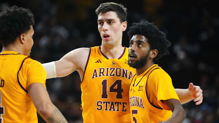Arizona State forward Andrija Grbović (14) gathers Bryce Ford (4) and Moe Odum (5) during a game against Cincinnati at Desert Financial Arena in Tempe, Ariz., on Jan. 24, 2026.