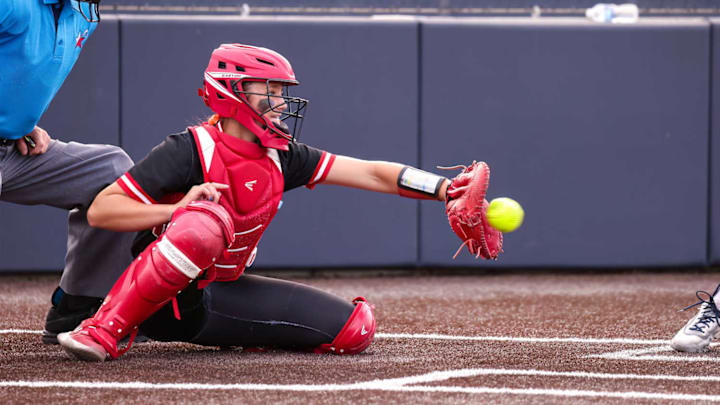 Melissa sophomore catcher Hutton "LuLu" Adrian catches a pitch against Prosper Walnut Grove in a game on April 18, 2025. Adrian went 3-for-3 in the game with a home run, double, RBI and a run scored in a 17-3 win. 