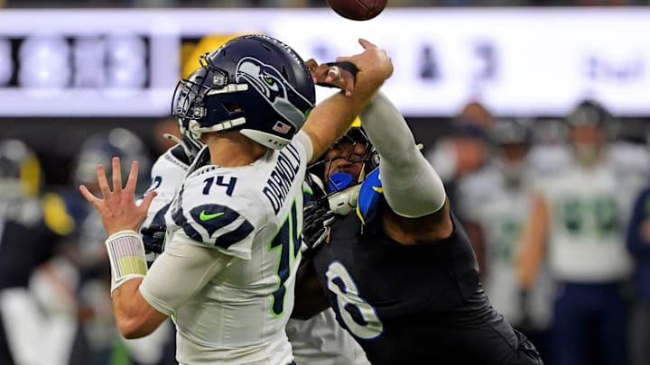 Nov 16, 2025; Inglewood, California, USA; Los Angeles Rams linebacker Jared Verse (8) knocks the ball away from Seattle Seahawks quarterback Sam Darnold (14) for an incomplete pass during the second half at SoFi Stadium. 