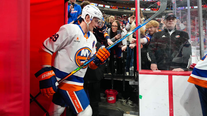 Dec 17, 2024; Raleigh, North Carolina, USA;  New York Islanders center Brock Nelson (29) goes past the fans for the warmups before the game against the Carolina Hurricanes at Lenovo Center. Mandatory Credit: James Guillory-Imagn Images