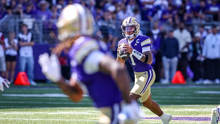UW quarterback Demond Williams Jr. rolls out looking for a receiver. UW quarterback Demond Williams Jr. rolls out looking for a receiver.