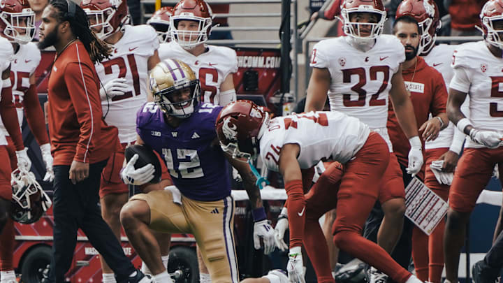 Denzel Boston comes up with a catch in the Apple Cup in 2024. 